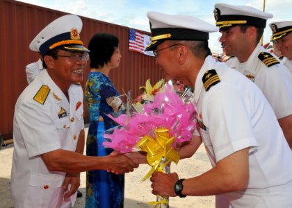 US Navy 100810-N-3215T-162 Cmdr. Jeffrey Kim greets a senior officer of the Vietnam People's Navy following the arrival of USS John S. McCain (DDG 56) in Da Nang, Vietnam
