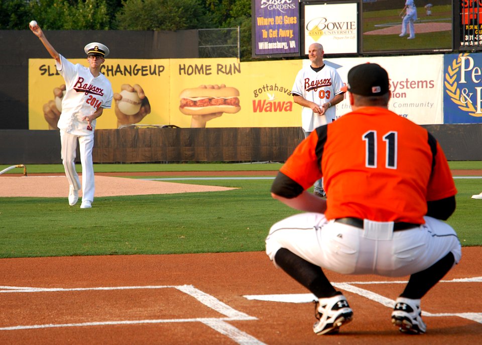 US Navy 100810-N-3857R-008 U.S. Naval Academy Midshipman 4th Class Chris House throws out one of the ceremonial first pitches on the field of Prince George's Stadium at the 11th annual Navy Night at the Baysox