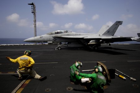 US Navy 100812-N-6362C-159 A shooter signals for the launching of an F-A-18F Super Hornet aboard USS Harry S. Truman (CVN 75)