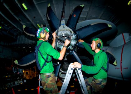 US Navy 100810-N-6720T-004 Sailors install a variable pitch propeller on an E-2C Hawkeye from the Liberty Bells of Airborne Early Warning Squadron (VAW) 115 aboard the aircraft carrier USS George Washington (CVN 73)