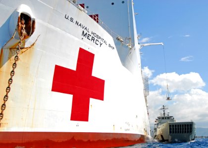 US Navy 100811-N-4044H-220 The Military Sealift Command hospital ship USNS Mercy (T-AH 19) loads cargo aboard the Royal Australian Navy heavy landing craft HMAS Labuan (L128)