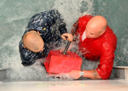 US Navy 100812-N-3283P-009 Chief Damage Controlman Matt Walz nd Master Chief Damage Controlman David Singer demonstrate how to apply a box patch to a ruptured bulkhead to Japanese college students