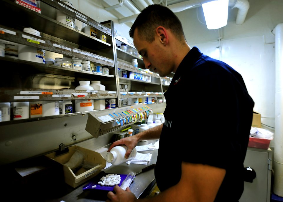 US Navy 100811-N-1287L-028 Hospital Corpsman 2nd Class Gerald A. Goniwicha inventories medicine in the pharmacy aboard USS Enterprise (CVN 65)