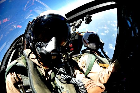 US Navy 100812-N-6003P-134 Mass Communication Specialist 2nd Class Kilho Park, left, and Lt. John Moss fly in an EA-6B Prowler during an aerial change of command ceremony