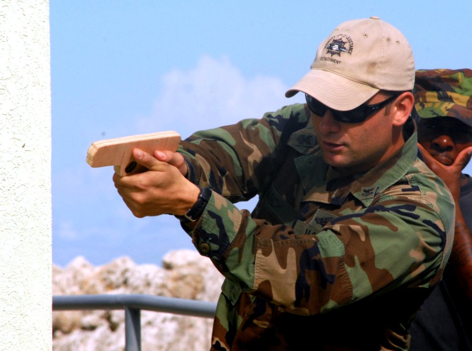 US Navy 100811-N-4971L-096 Equipment Operator 1st Class Daniel Lasich demonstrates proper close combat techniques for Barbados Defense Forces during a subject matter expert exchange in Bridgetown, Barbados