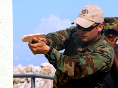 US Navy 100811-N-4971L-096 Equipment Operator 1st Class Daniel Lasich demonstrates proper close combat techniques for Barbados Defense Forces during a subject matter expert exchange in Bridgetown, Barbados