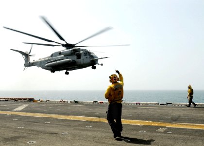 US Navy 100812-N-1226D-077 A U.S. Marine Corps CH-53E Super Stallion helicopter lifts off from USS Peleliu (LHA 5) in the Indian Ocean photo