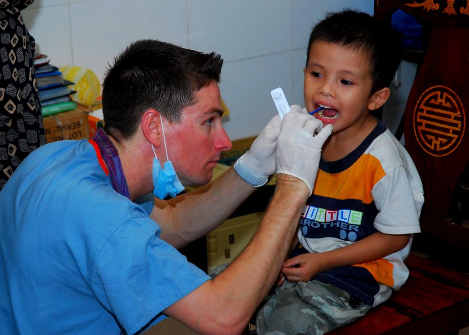 US Navy 100812-N-3589B-028 Hospital Corpsman 2nd Class Joseph Smith performs a pre-surgery check on a patient