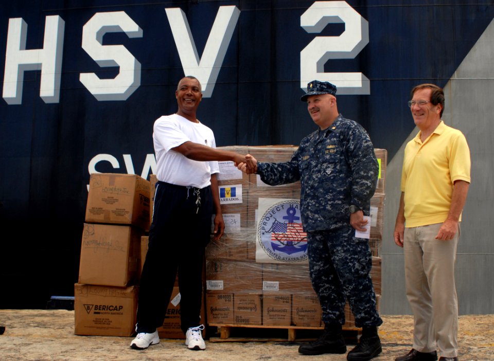 US Navy 100813-N-4971L-045 t. Cmdr. Ken Cremeans, center, deputy mission commander of Southern Partnership Station 2010