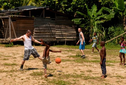 US Navy 100816-N-5319A-231 Sailors and Marines from USS New Orleans (LPD 18) play soccer with Colombian children after conducting an Amphibious-Southern Partnership Station 2010 community service project
