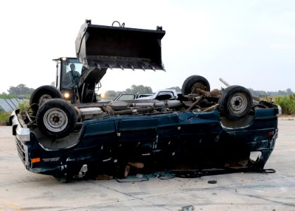 US Navy 100816-N-6357K-033 A Caterpillar 924G loader is used to crush a training vehicle for use during a vehicle extrication training exercise