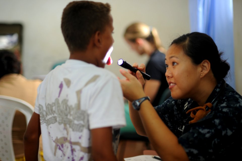US Navy 100812-N-9964S-168 Lt. Amanda Higginson treats a Colombian child at the pediatric center in Colombia