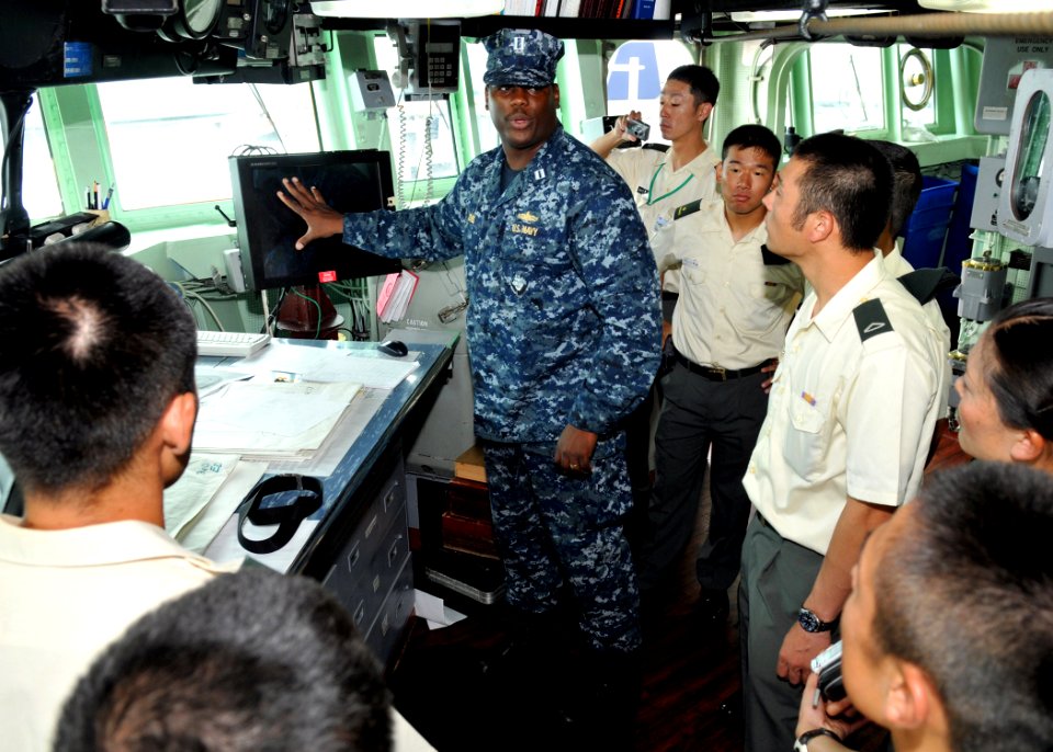 US Navy 100812-N-8113T-086 Lt. Bobby Jone describes the duties and responsibilities of the bridge watch team from the pilot house to a group of Japan Ground Self-Defense Force soldiers