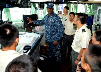 US Navy 100812-N-8113T-086 Lt. Bobby Jone describes the duties and responsibilities of the bridge watch team from the pilot house to a group of Japan Ground Self-Defense Force soldiers