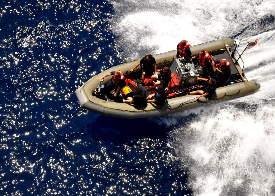 US Navy 100817-N-4649B-024 Sailors assigned to the multipurpose amphibious assault ship USS Bataan (LHD 5) conduct a rigid-hull inflatable boat recovery during a man overboard drill