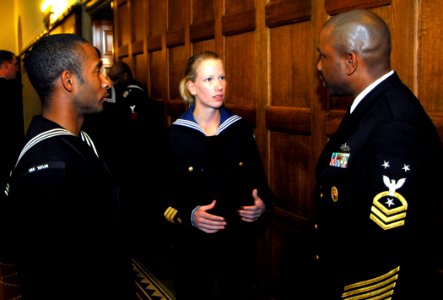 US Navy 100813-N-7638K-228 ommand Master Chief Steven Allen, right, and Quartermaster Seaman Josh Mobley, left, discuss the similarities and differences of their navies with a Swedish navy sailor during a reception hosted by th