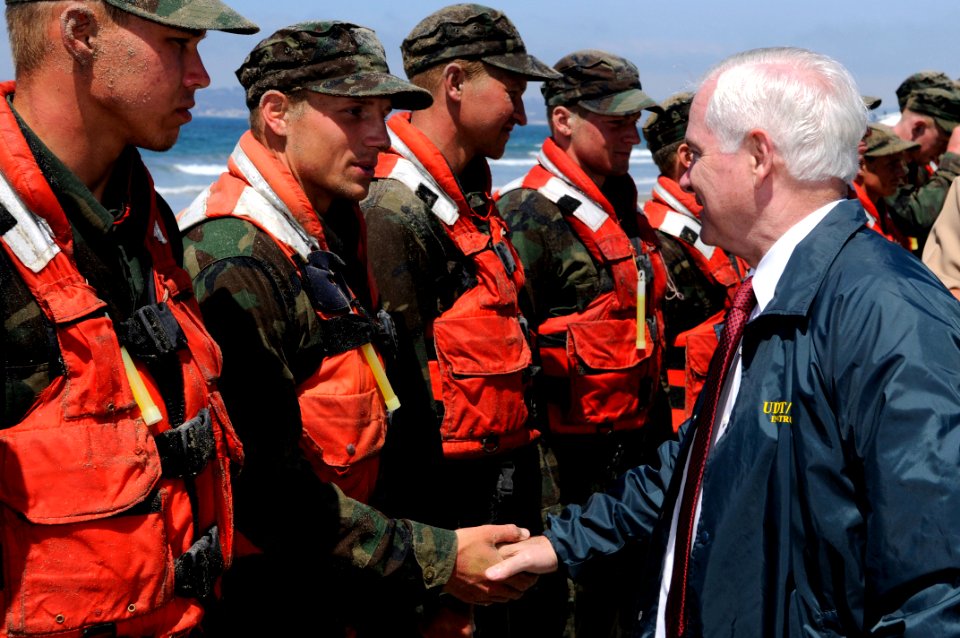 US Navy 100813-N-7883G-125 Secretary of Defense Robert M. Gates congratulates a candidate from Basic Underwater Demolition-Sea, Air and Land (BUD-S) class 284 after securing him and his peers from Hell Week