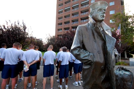 US Navy 100816-N-6676S-023 Chief petty officer (CPO) selectees listen to a tour guide explain the history of The Lone Sailor statue