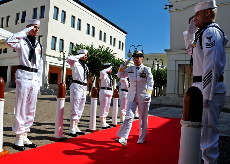 US Navy 100818-N-1512O-017 Capt. Cindy Thebaud, commander of Destroyer Squadron (DESRON) 60, salutes the sideboys as she arrives at her change of command ceremony