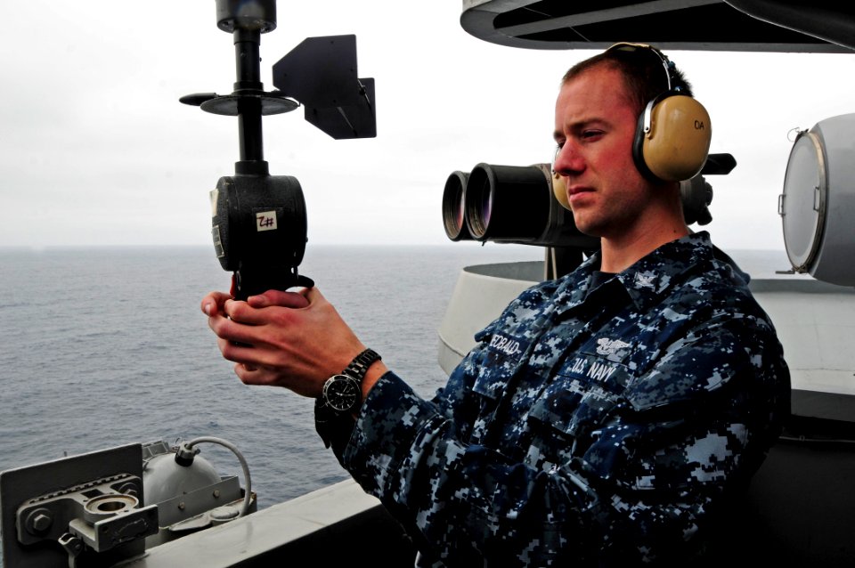 US Navy 100816-N-2918M-042 Aerographer's Mate 3rd Class Shaun Theobald, from Topeka, Kansas, uses a PMQ-3 hand-held