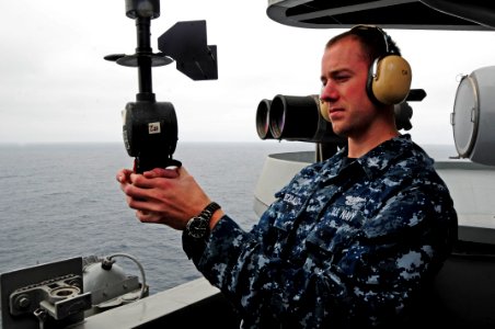 US Navy 100816-N-2918M-042 Aerographer's Mate 3rd Class Shaun Theobald, from Topeka, Kansas, uses a PMQ-3 hand-held