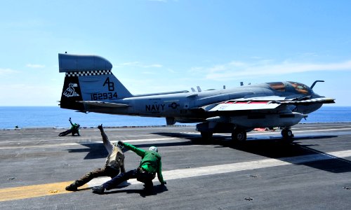 US Navy 100816-N-0569K-005 Sailors give flight deck personnel and pilots the all-clear signal to launch an EA-6B Prowler aboard USS Enterprise (CVN 65)