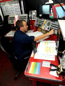 US Navy 100814-N-6362C-014 Aviation Ordnanceman 2nd Class Shawn Locklear contacts an ordnance magazine via the 46-MC circuit from weapons' department ordnance control aboard USS Harry S. Truman (CVN 75)