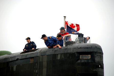 US Navy 100816-N-3090M-167 Sailors aboard the Canadian navy Victoria-class long-range patrol submarine HMCS Corner Brook (SSK 878) oversee mooring operations from the sail photo
