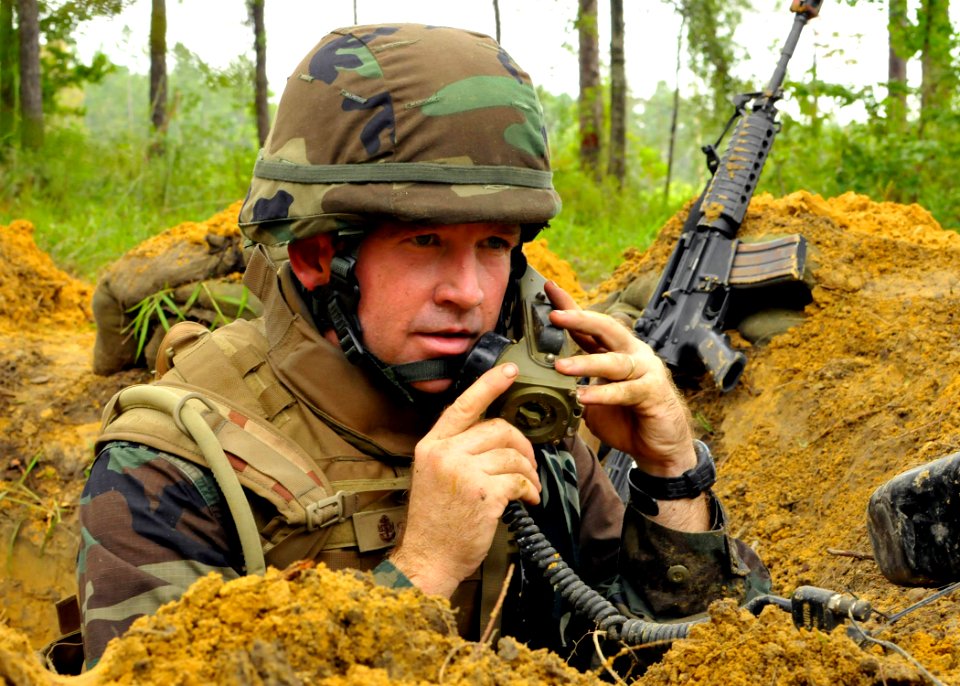 US Navy 100819-N-4440L-260 Chief Navy Counselor Jeremy Stalling, assigned to Naval Mobile Construction Battalion (NMCB) 74, uses a TA-1 sound powered phone from his defensive line position