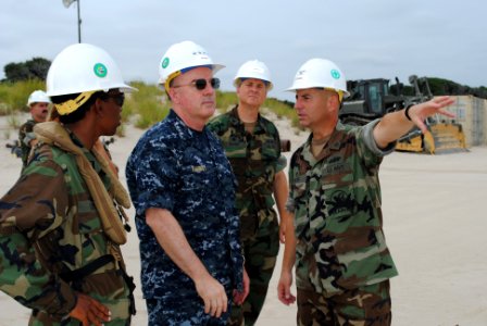 US Navy 100818-N-1580K-303 Capt. Paul Webb explains to Adm. J. C. Harvey Jr. the logistical and technological advantages of the Navy Elevated Causeway System-Modular (ELCAS(M))