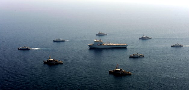 US Navy 100816-N-8959T-443 British and U.S. Navy mine countermeasures ships surround RFA Lyme Bay (L3007), center