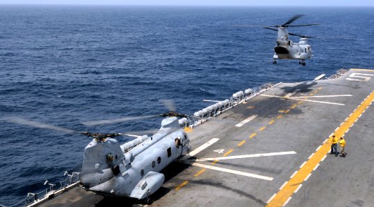 US Navy 100818-N-3729D-046 A CH-46 Sea Knight helicopter assigned to the White Knights of Helicopter Marine Medium Squadron (HMM 165) (Reinforced) launches aboard the amphibious assault ship USS Peleliu (LHA 5)