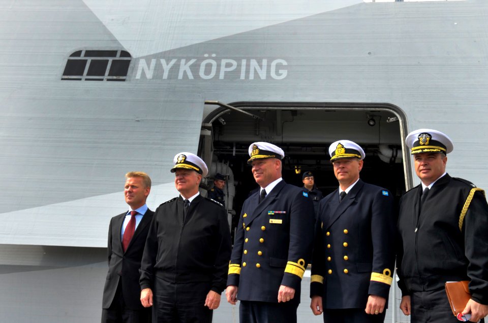 US Navy 100819-N-8273J-054 Chief of Naval Operations (CNO) Adm. Gary Roughead, second from left, poses for a photo prior to boarding the Swedish Navy Visby Corvette HSwMS NYKOPING