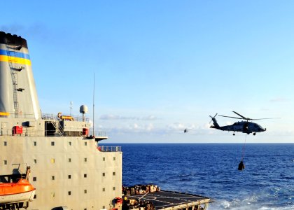 US Navy 100819-N-1287L-053 An HH-60H Sea Hawk helicopter assigned to the Dragonslayers of Helicopter Anti-Submarine Squadron (HS) 11 transports cargo to the aircraft carrier USS Enterprise (CVN 65)