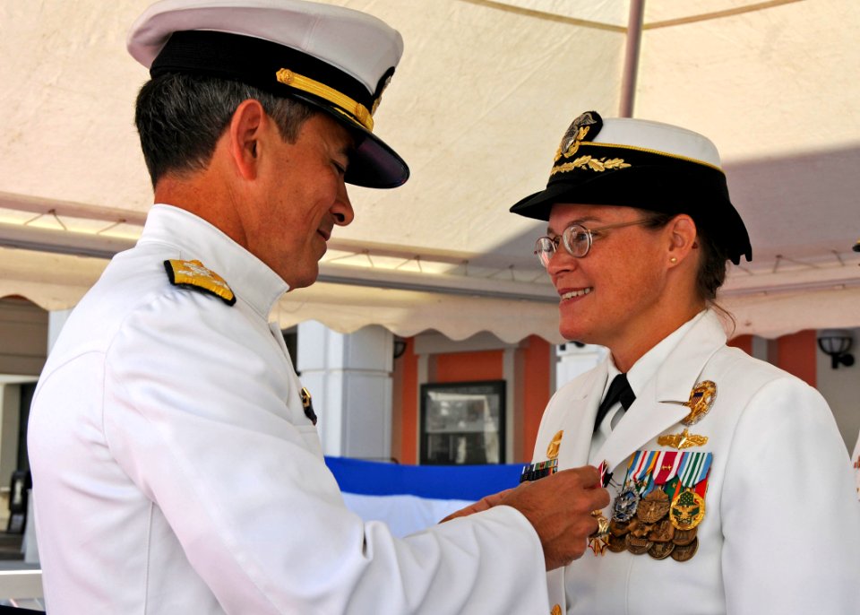 US Navy 100818-N-1512O-125 Vice Adm. Harry B. Harris, Jr., commander of the U.S. 6th Fleet, presents the Legion of Merit medal to Capt. Cindy Thebaud