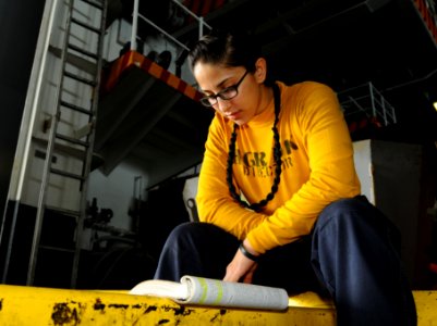 US Navy 100818-N-1092P-109 Aviation Boatswain's Mate (Handling) Airman Stephanie Rodriguez studies for her 3rd Class Petty Officer Advancement exam aboard USS Harry S. Truman (CVN 75)