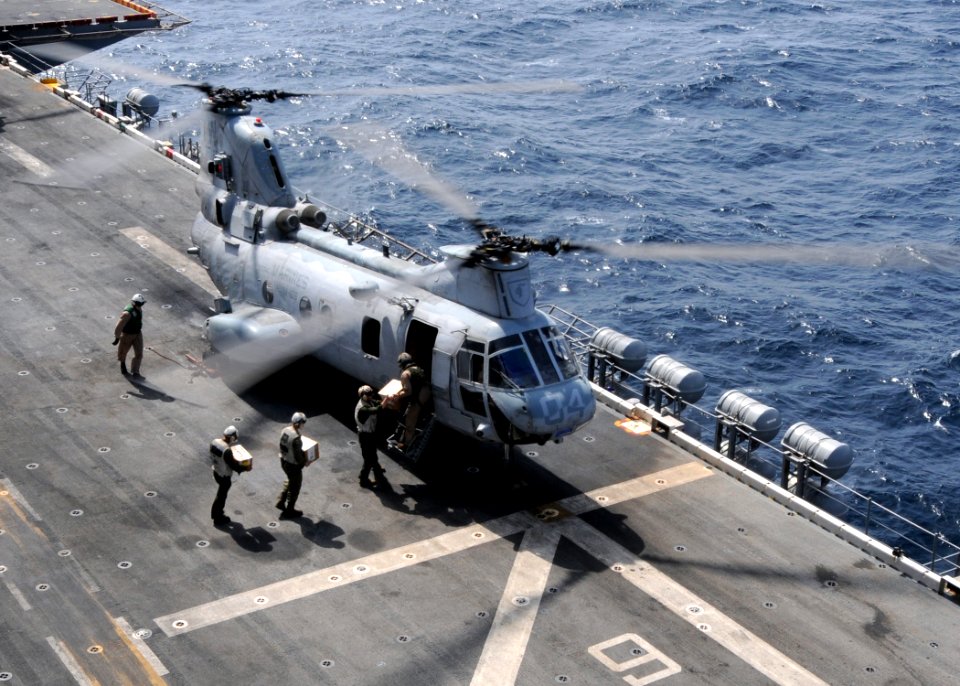 US Navy 100818-N-3729D-016 Marines assigned the U.S. Navy amphibious assault ship USS Peleliu (LHA 5) load supplies onto a CH-46 Sea Knight helicopter