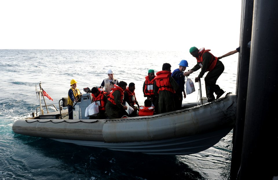 US Navy 100820-N-6362C-064 Sailors aboard the aircraft carrier USS Harry S. Truman (CVN 75) prepare to transport eight mariners in a rigid-hull inflatable boat to the Iranian navy ship Chiroo