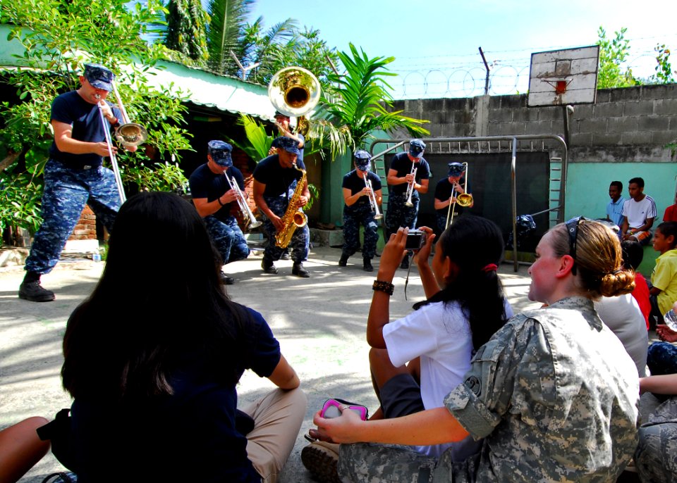 US Navy 100818-N-4044H-052 Members of the U.S. Pacific Fleet Band, embarked aboard the Military Sealift Command hospital ship USNS Mercy (T-AH 19), perform during a community service event at Santa Bakhita Orphanage