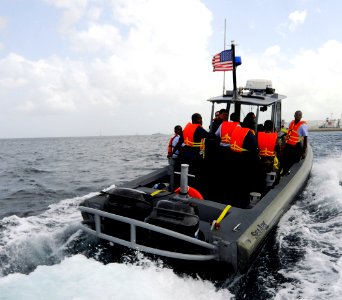 US Navy 100818-N-9643W-163 Sailors from the U.S. Navy and the Royal Barbados Defense Force ride in a rigid-hull inflatable boat during a Naval Criminal Investigative Service subject matter expert exchange photo