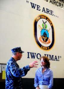 US Navy 100821-N-1531D-135 Capt. Thomas Negus, commodore of Continuing Promise 2010, speaks with U.S. Ambassador to Costa Rica Anne Andrews during a tour of the multipurpose amphibious assault ship USS Iwo Jima (LHD 7) photo