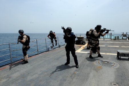 US Navy 100821-N-6463B-485 Visit, board, search and seizure team members maintain security positions on the fantail aboard USS Princeton (CG 59) during a mock boarding operation in the Red Sea