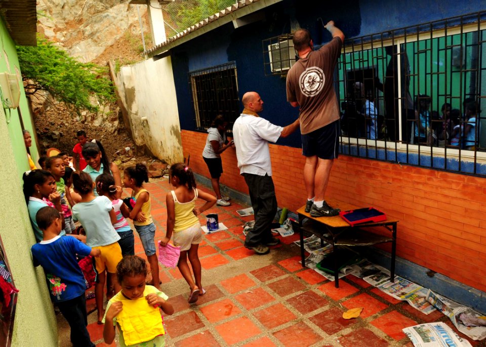 US Navy 100821-N-9301W-743 Sailors paint the side of the John F. Kennedy Educational Institution during a joint community relations project with the Colombian national navy in Santa Marta, Colombia