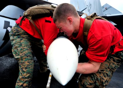 US Navy 100823-N-0569K-043 Marines load CATM-7 ordnance onto an F-A-18C Hornet