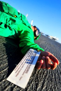 US Navy 100823-N-2953W-183 A Sailor simulates a fatal injury during a mass casualty drill on the flight deck of the Nimitz-class aircraft carrier USS Carl Vinson (CVN 70)