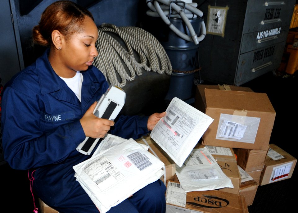 US Navy 100823-N-6427M-026 Logistics Specialist Seaman Monica Payne scans repair parts before they are issued to the receiving squadrons and departments aboard the aircraft USS Harry S. Truman (CVN 75)