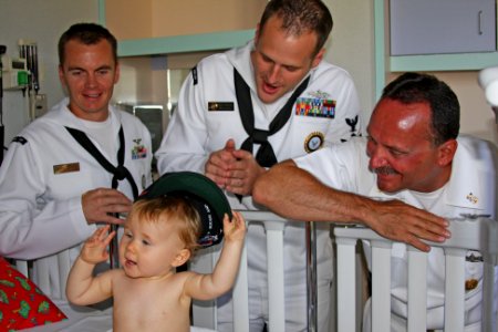US Navy 100820-N-3038C-001 Command Master Chief Dave Bisson and area Sailors present a Navy ball cap to a patient at St. Luke's Children's Hospital during Boise Navy Week