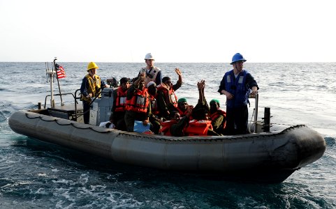 US Navy 100820-N-6362C-073 Eight mariners wave farewell to Sailors aboard the aircraft carrier USS Harry S. Truman (CVN 75) as they are transported to the Iranian navy ship Chiroo