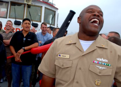 US Navy 100823-N-7642M-109 Chief Yeoman Antonio Franklin sings along with chief selects on their way to USS Constitution for the start of Chief Heritage Week