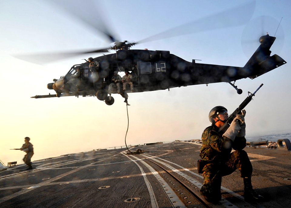 US Navy 100820-N-8689C-299 Members of Fuerza de Operaciones Especiales fast rope from a UH-60 Blackhawk helicopter onto the flight deck of USS Carr (FFG 52)